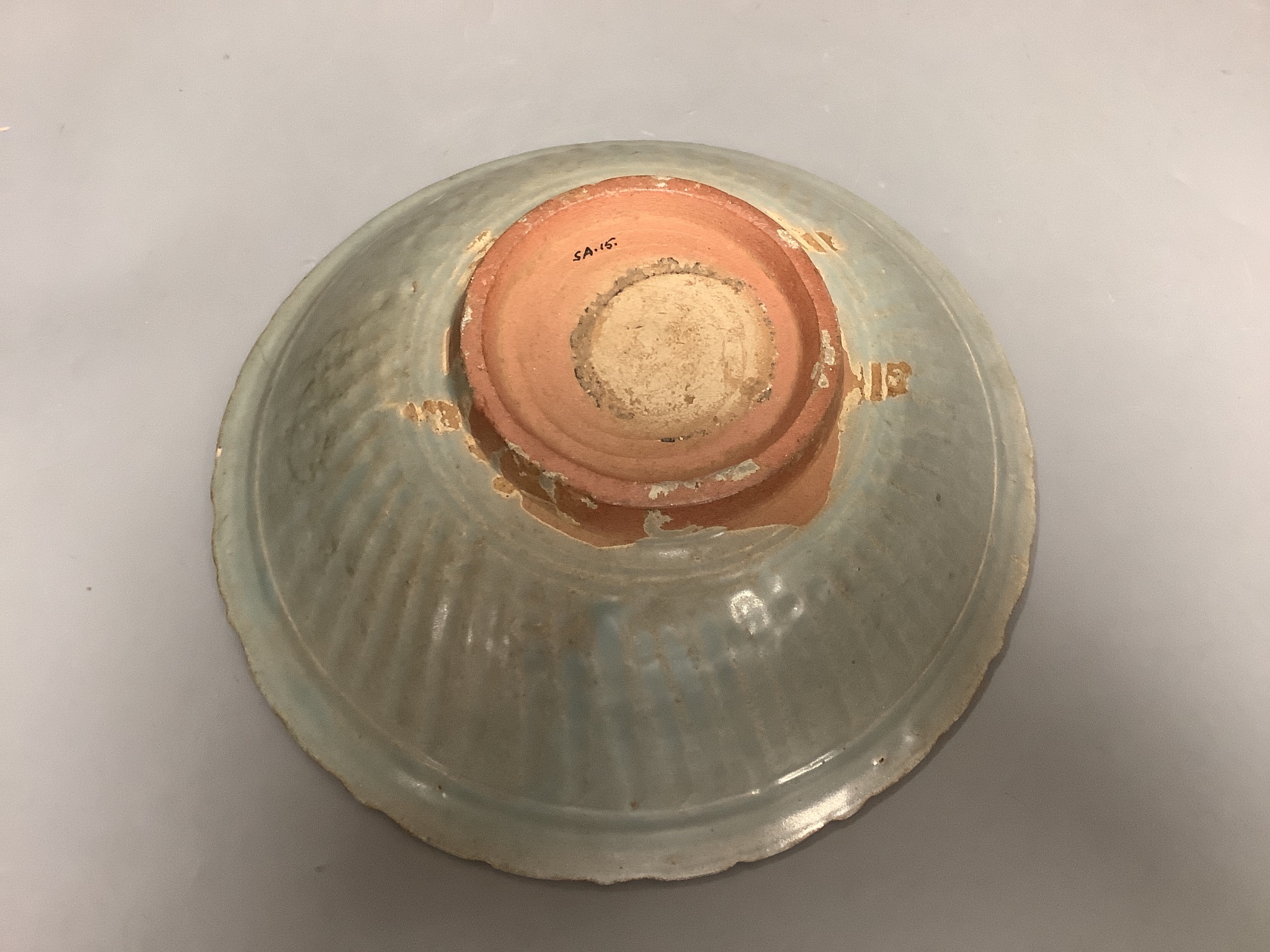 A Thai Sawankhalok celadon bowl, 14th-16th century, 28cms diameter